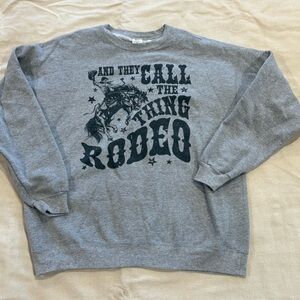 Graphic western sweatshirt crewneck “They call the thing rodeo” size large